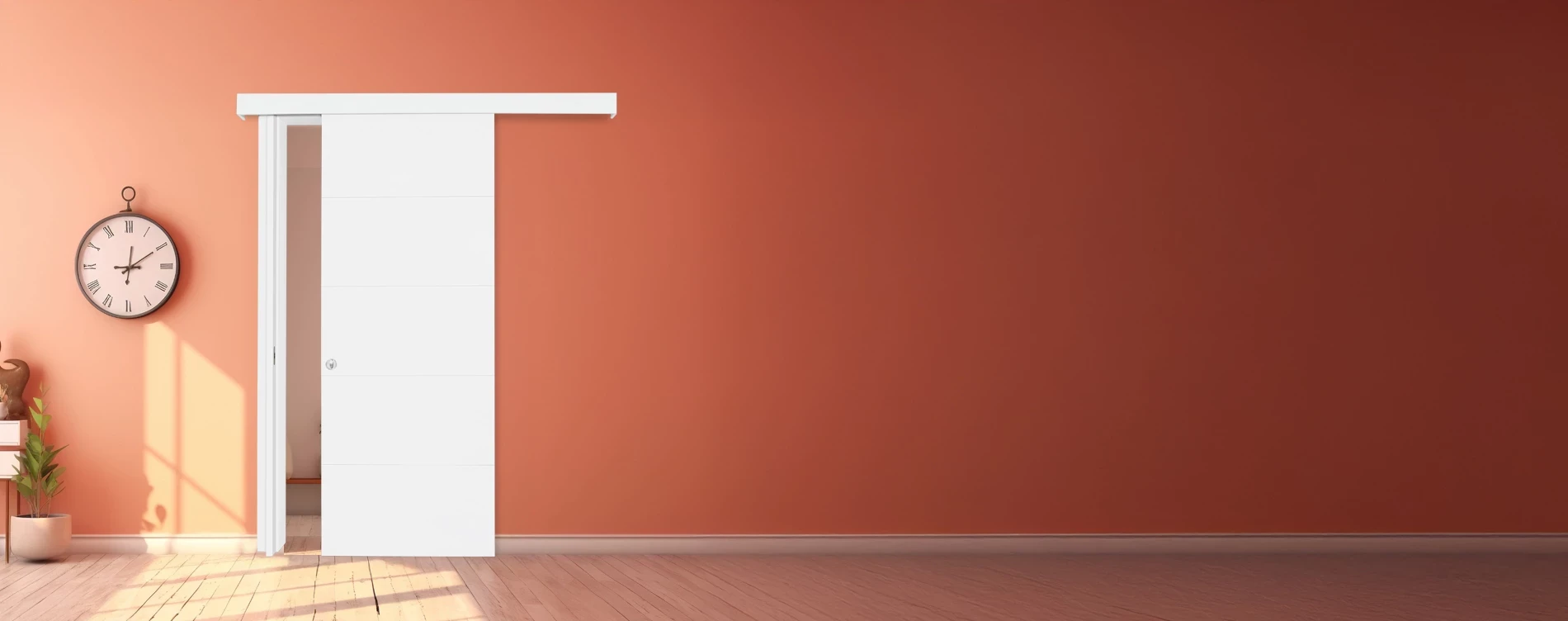 קיר כתום שעליו תלוי שעון קיר ודלת הזזה לבנה של פנדור